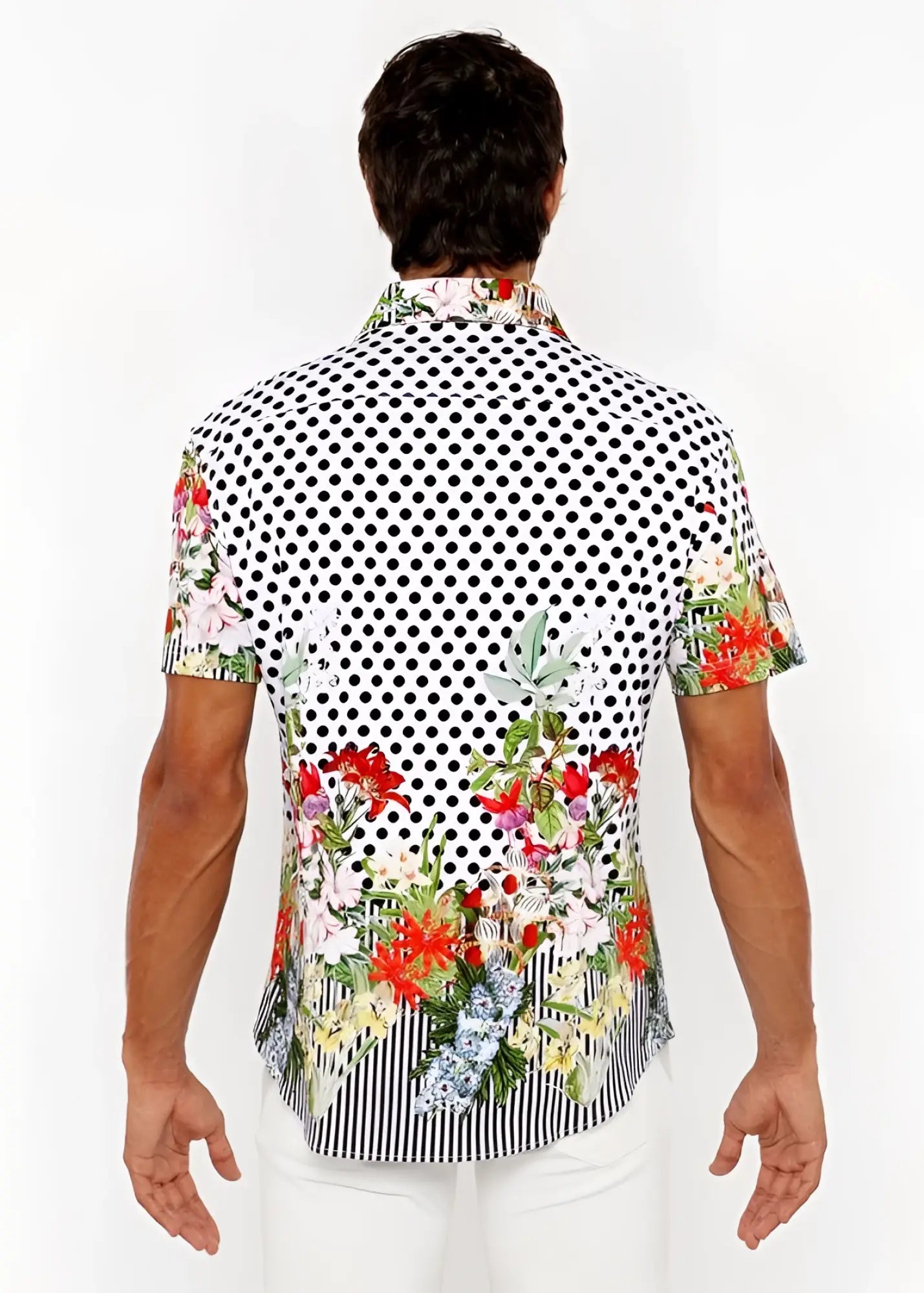 A vibrant short-sleeved men’s woven modal shirt with black and white polka dots and colorful floral border prints