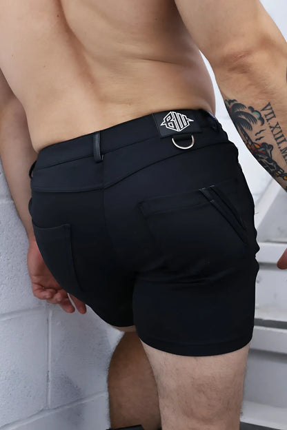 Black down low shorts featuring sleek modern design and branded patch on waistband for athletic use