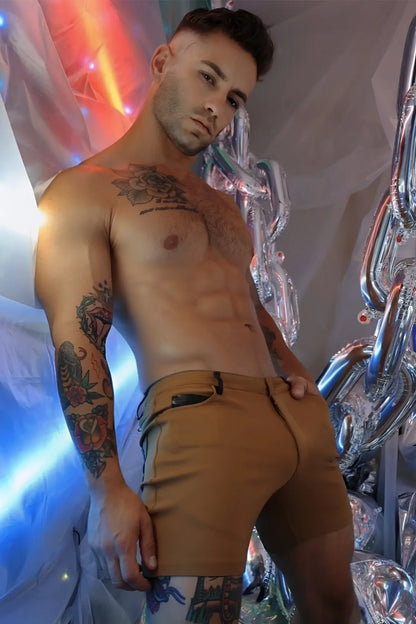 Tan down low shorts in dark khaki feature a zipper pocket on the right thigh and button closure for secure fit