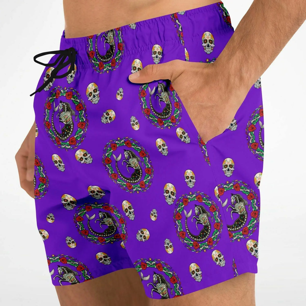 Men's swim shorts in vibrant purple with a Day of the Dead skull and floral pattern by Maris Equi featuring side pockets.