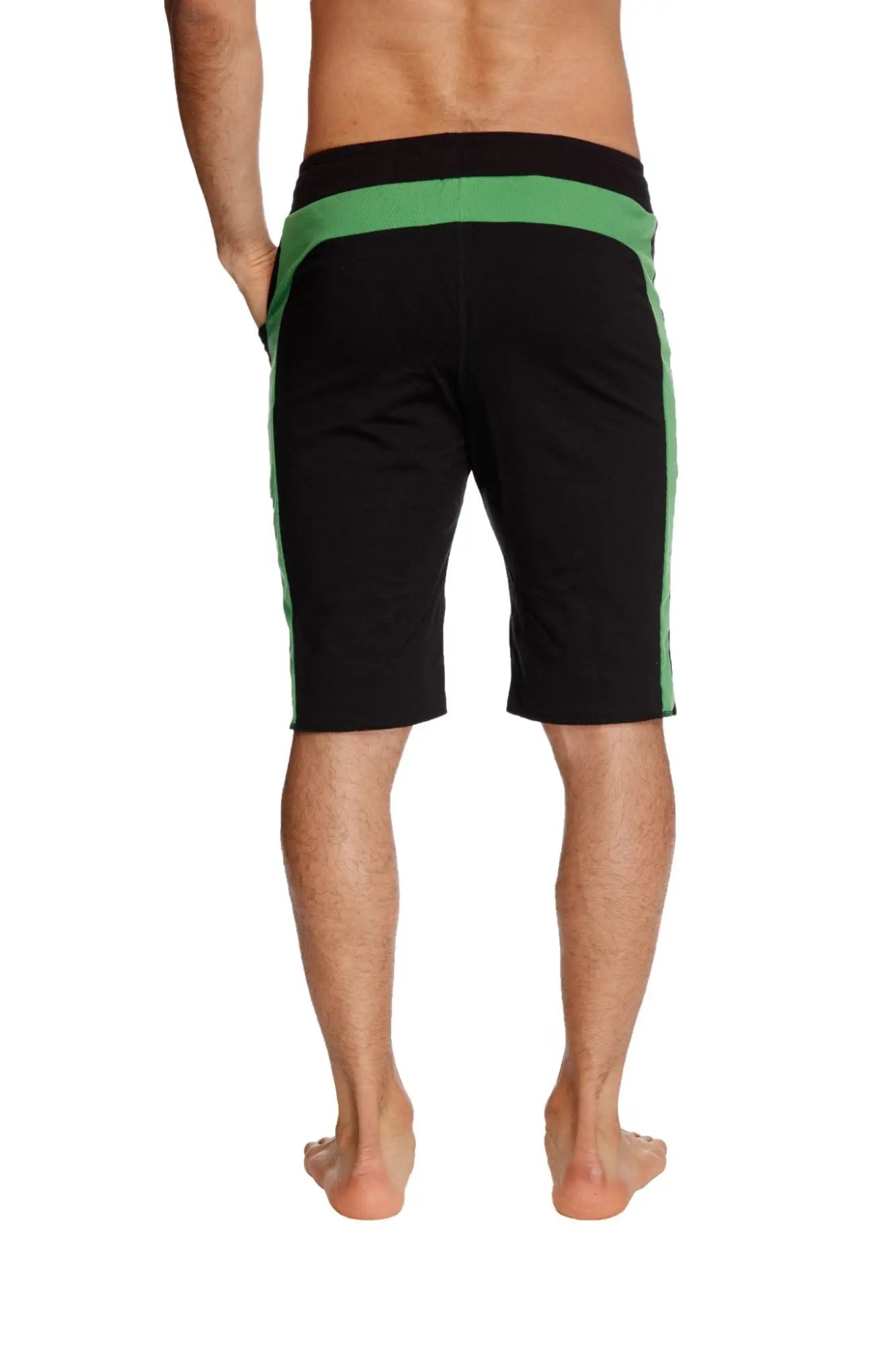 Eco-track short in black with vibrant bamboo green side stripes and waistband made from eco-friendly materials