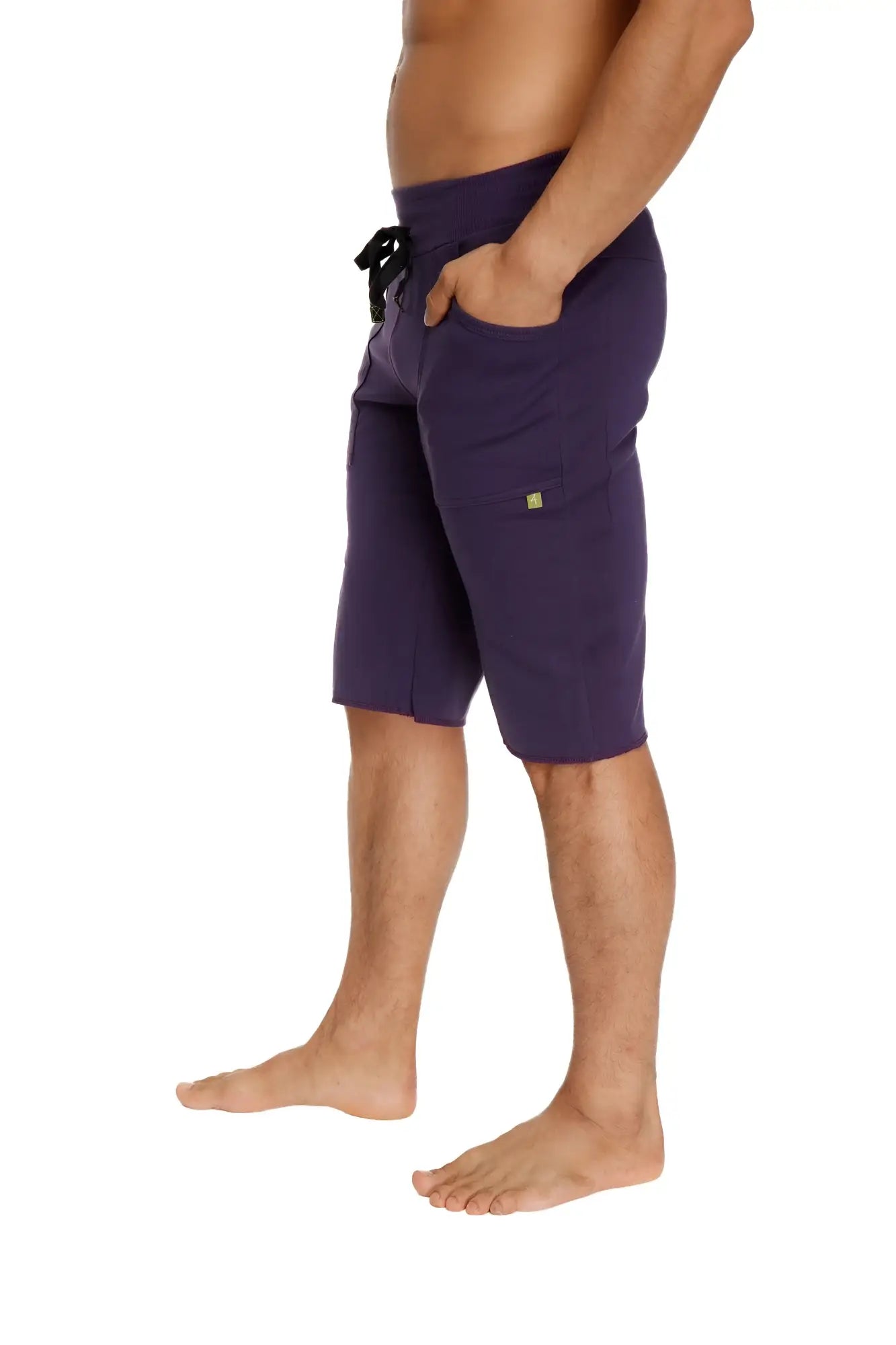 Purple eco-track athletic shorts with black drawstring waistband and side pockets made from sustainable fabric