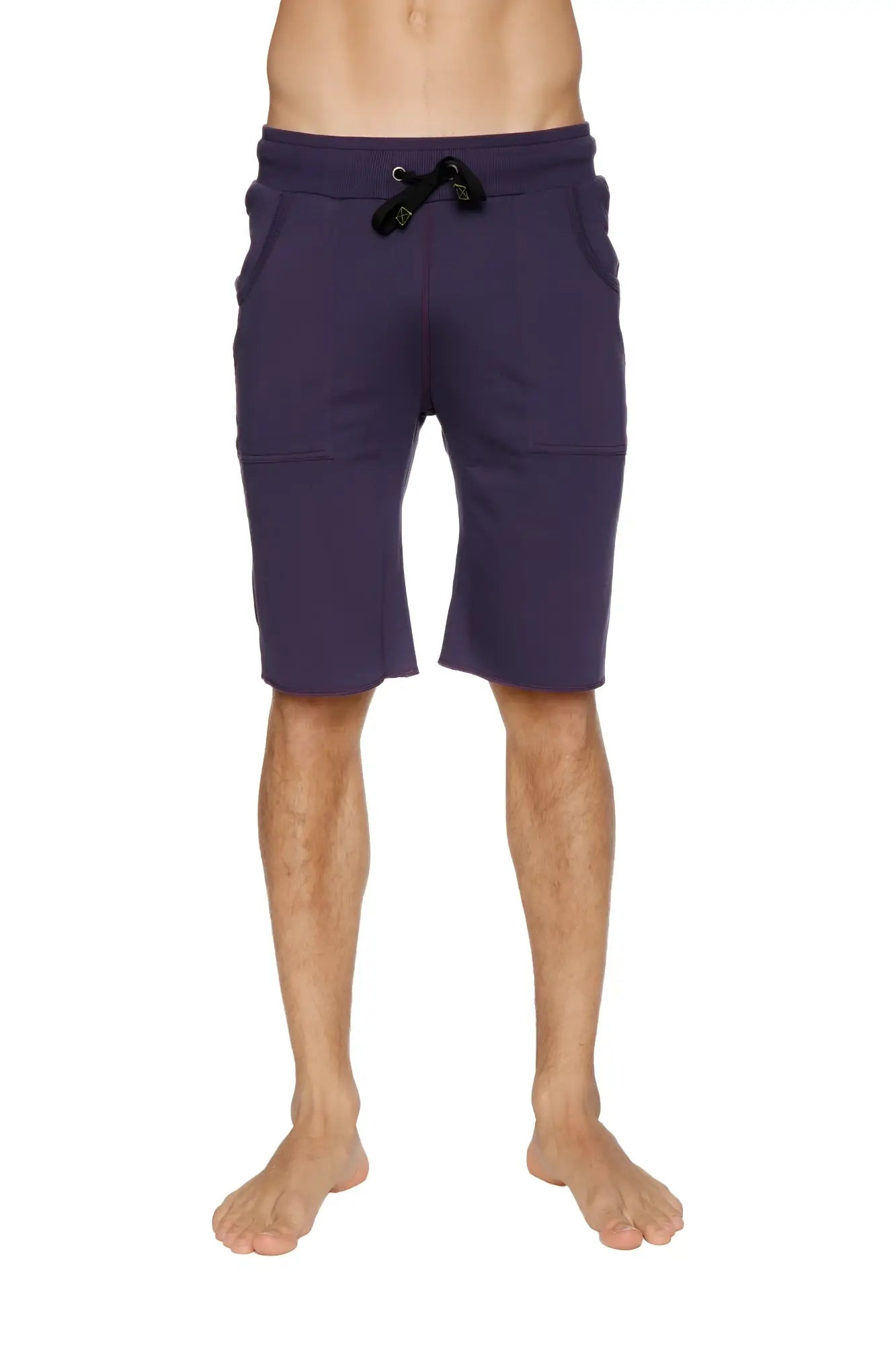 Eco-track short in eggplant purple with black drawstring waistband and two front pockets for athletic use