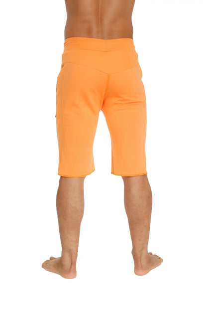 Eco-track short in sun orange with relaxed fit and side pockets made from eco-friendly material for athletic use