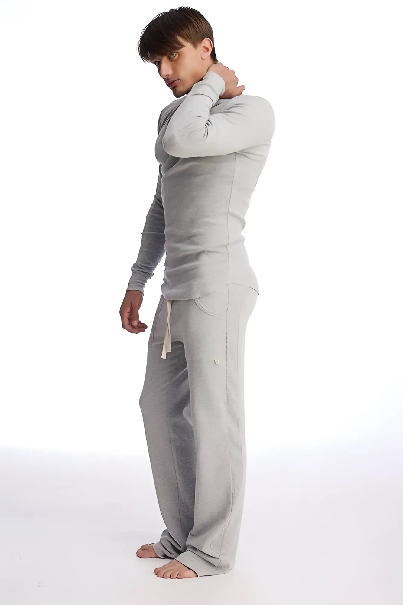Gray eco track and yoga sweat pant and long sleeve top set made of soft fabric with relaxed fit in solid heather gray