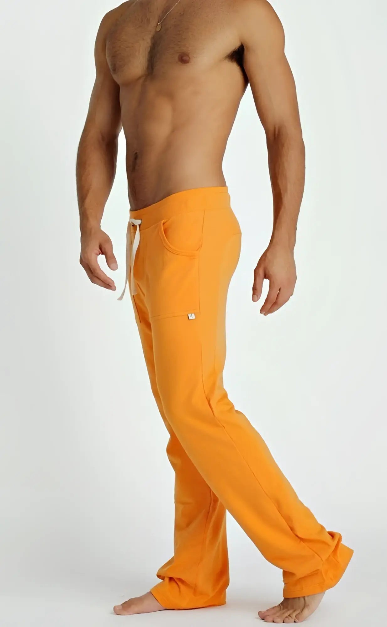 Orange eco-track and yoga sweat pant with white drawstring and side pockets made from eco-friendly material
