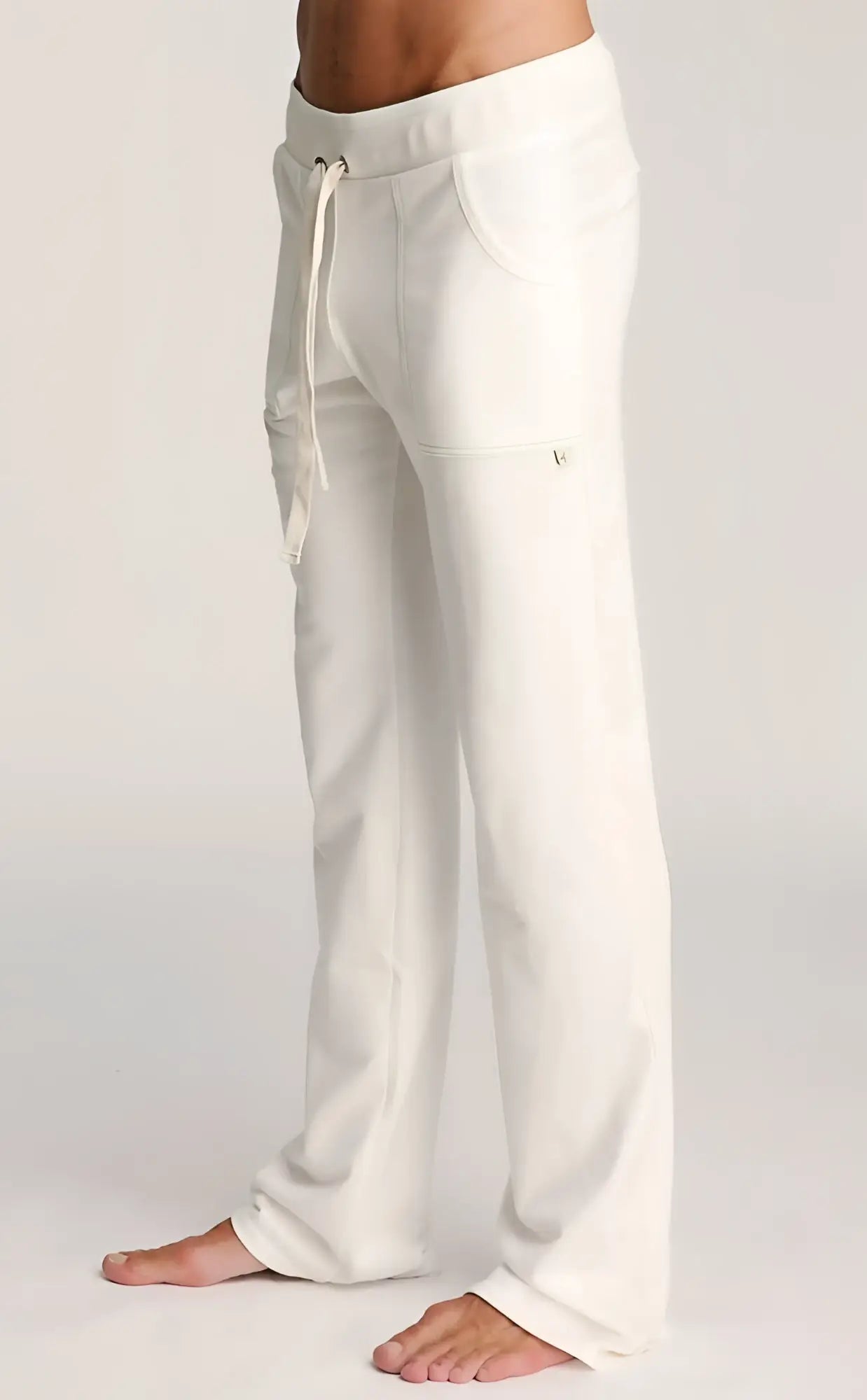 White eco-track and yoga sweat pant made of soft cotton with a drawstring waistband and side pockets