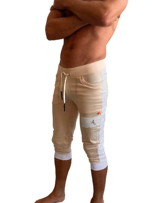 Beige and white edge cuffed yoga capri pants with drawstring waistband side pockets and embroidered logo patch on thigh