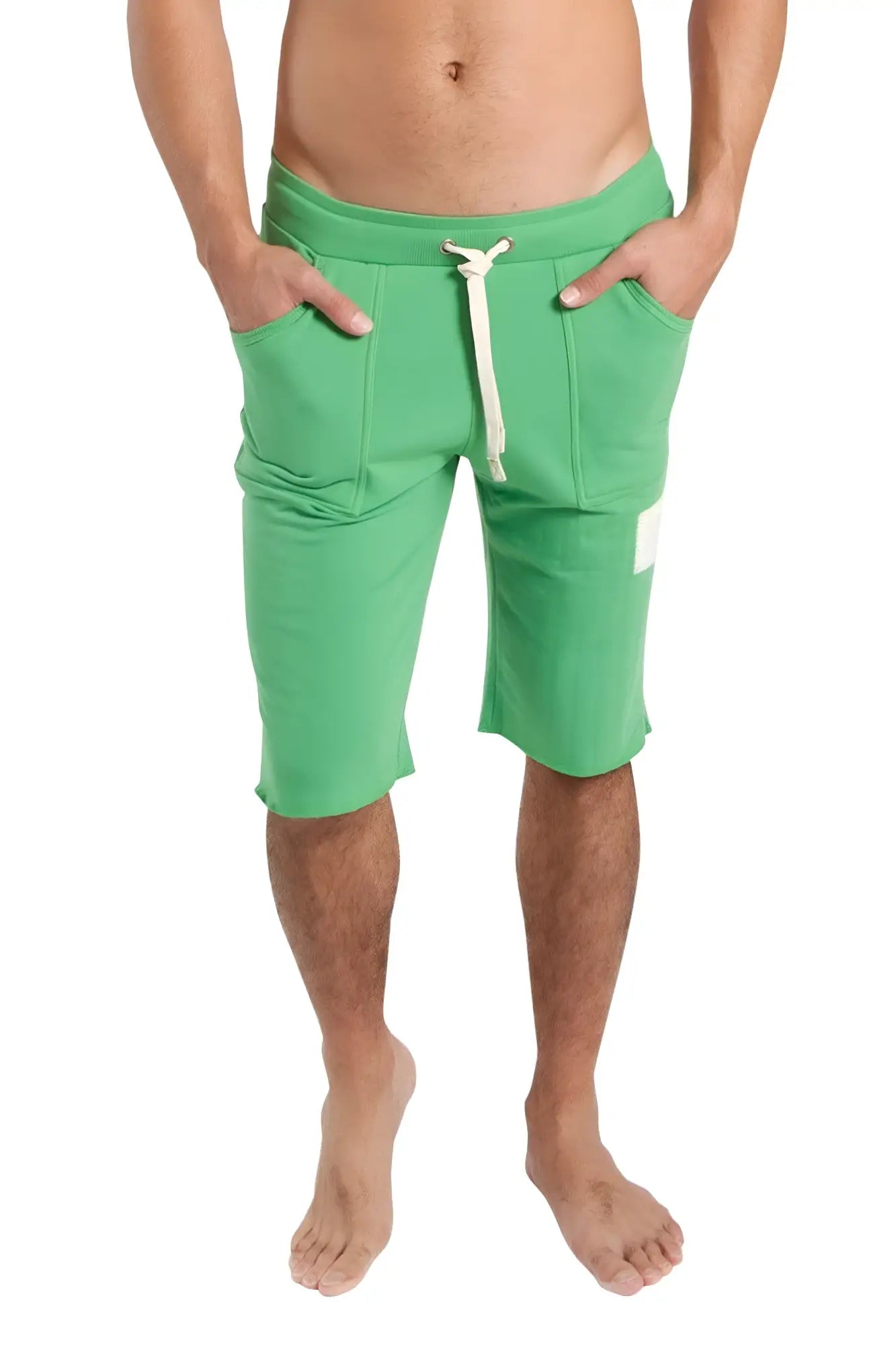 Green athletic edge eco-track shorts with white drawstring and side pockets made from bamboo material