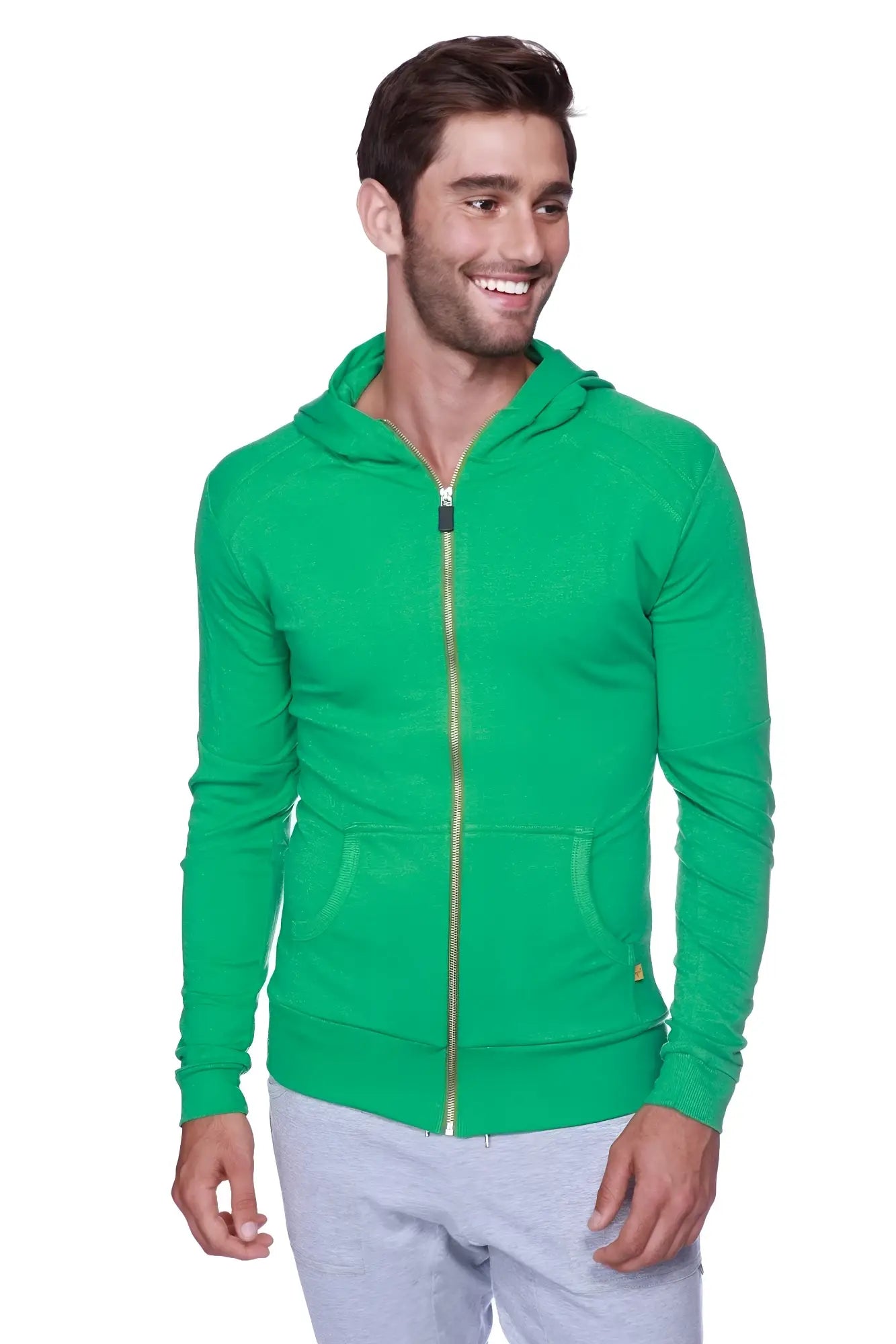 A vibrant green edge form-fit crossover yoga track hoodie with gold zipper and front pockets made from bamboo fabric