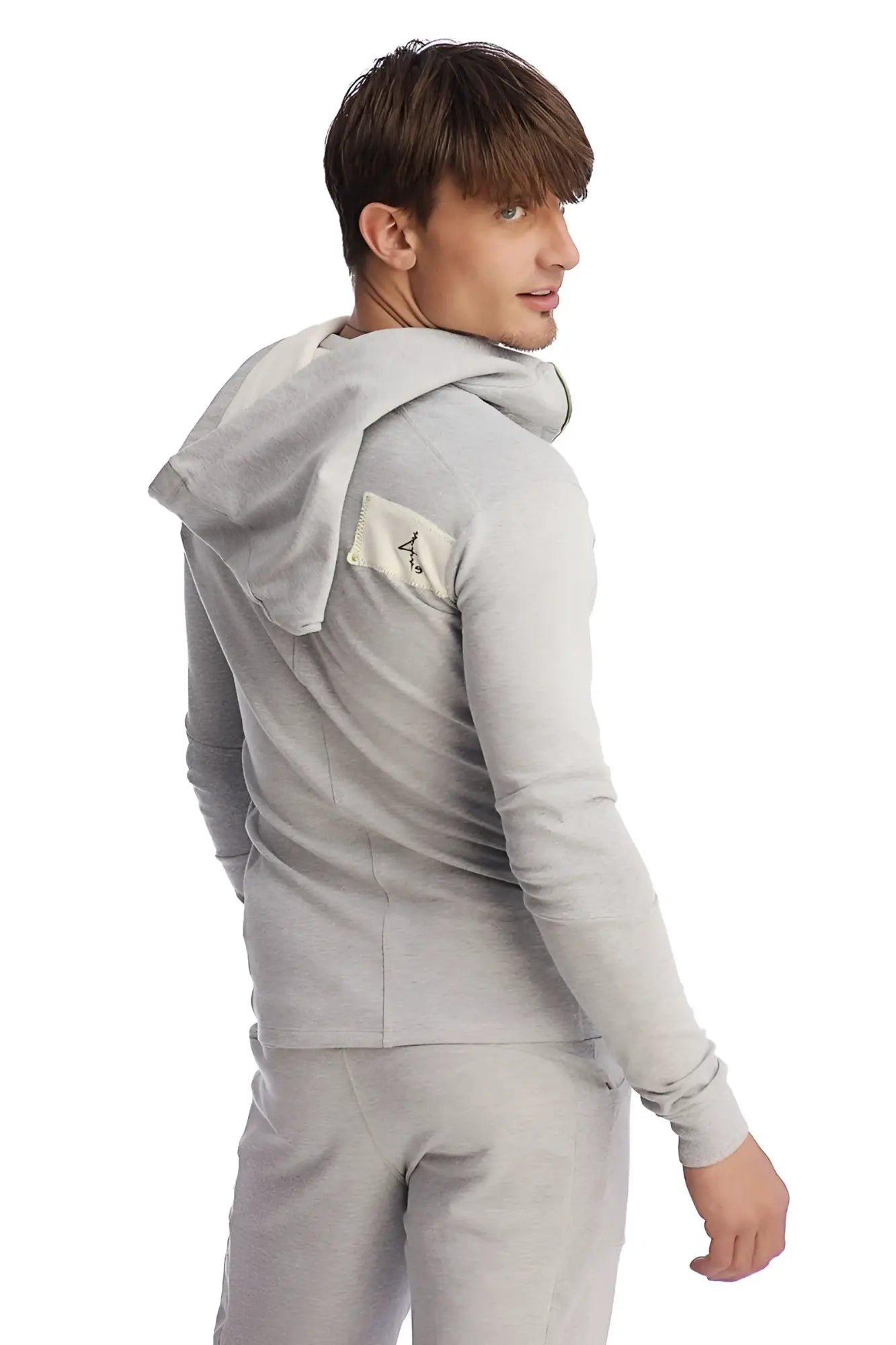 Gray heather edge form-fit crossover yoga track performance hoodie with small beige patch on left shoulder