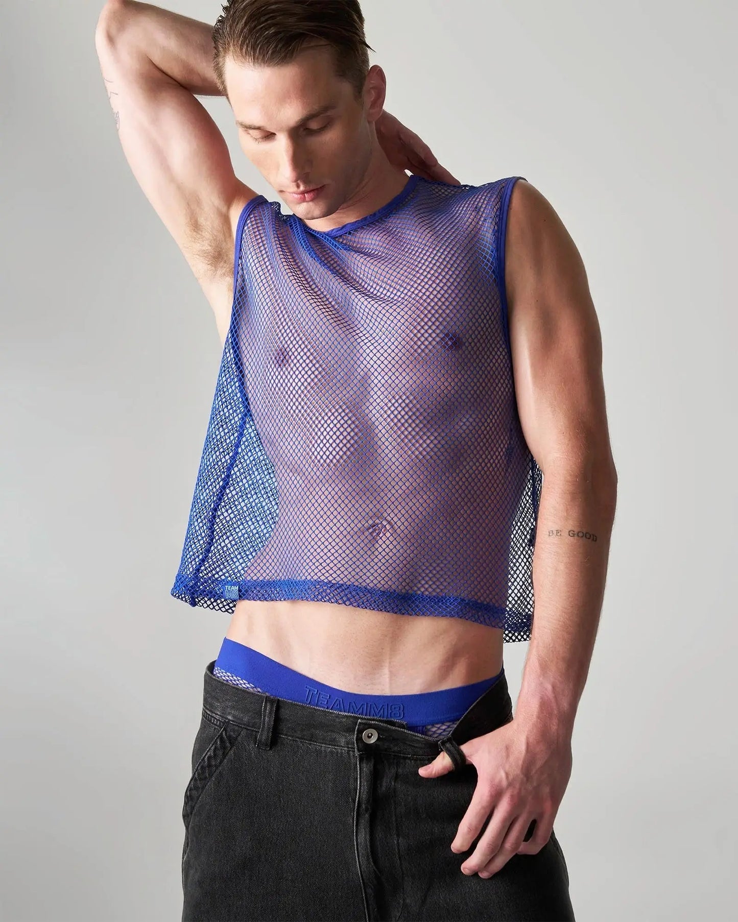 Blue edge net mesh muscle tank sleeveless top with sheer translucent fabric and reinforced trim along neckline and hem