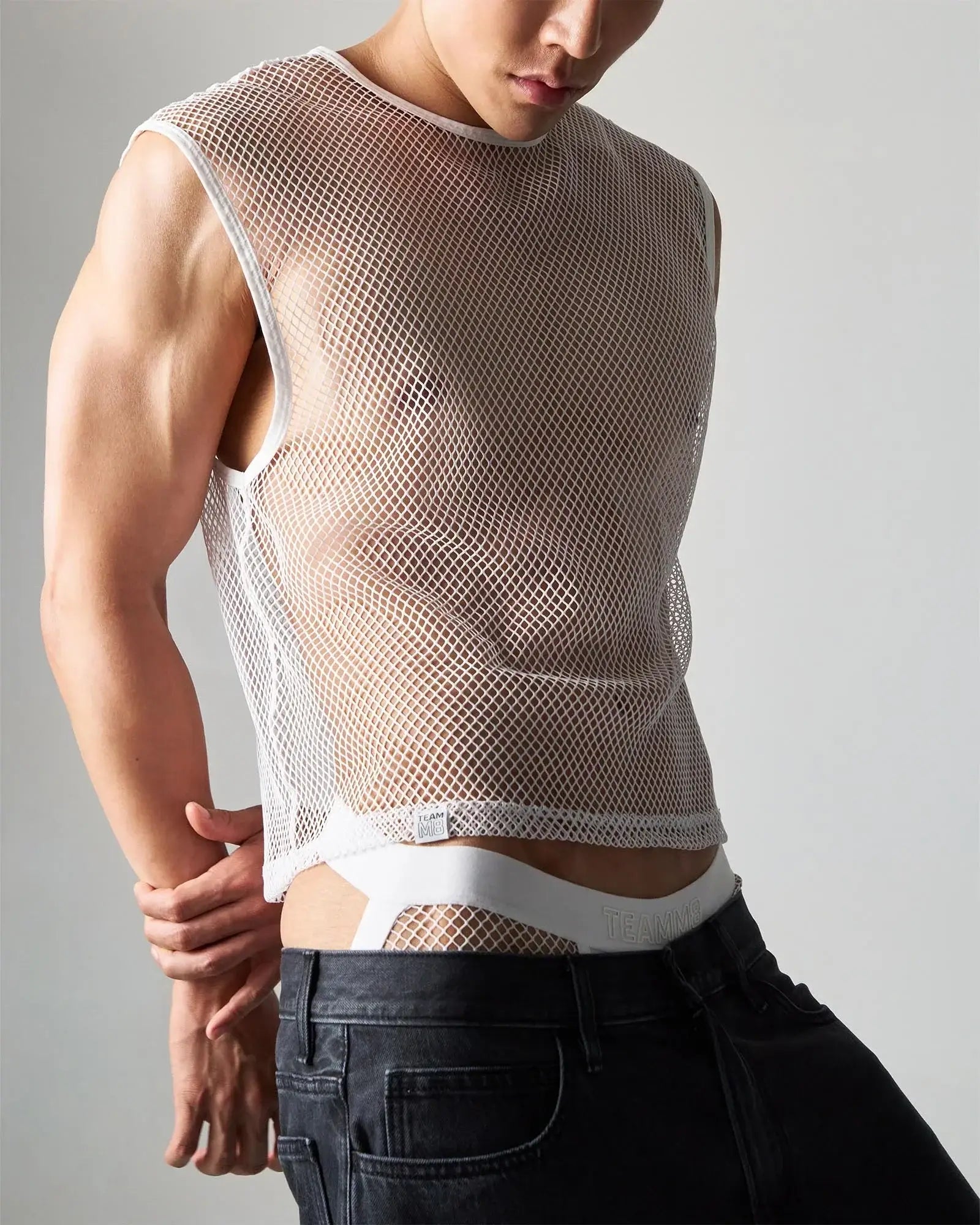 White edge net mesh muscle tank sleeveless top with rounded neckline and elasticated hem in breathable mesh fabric