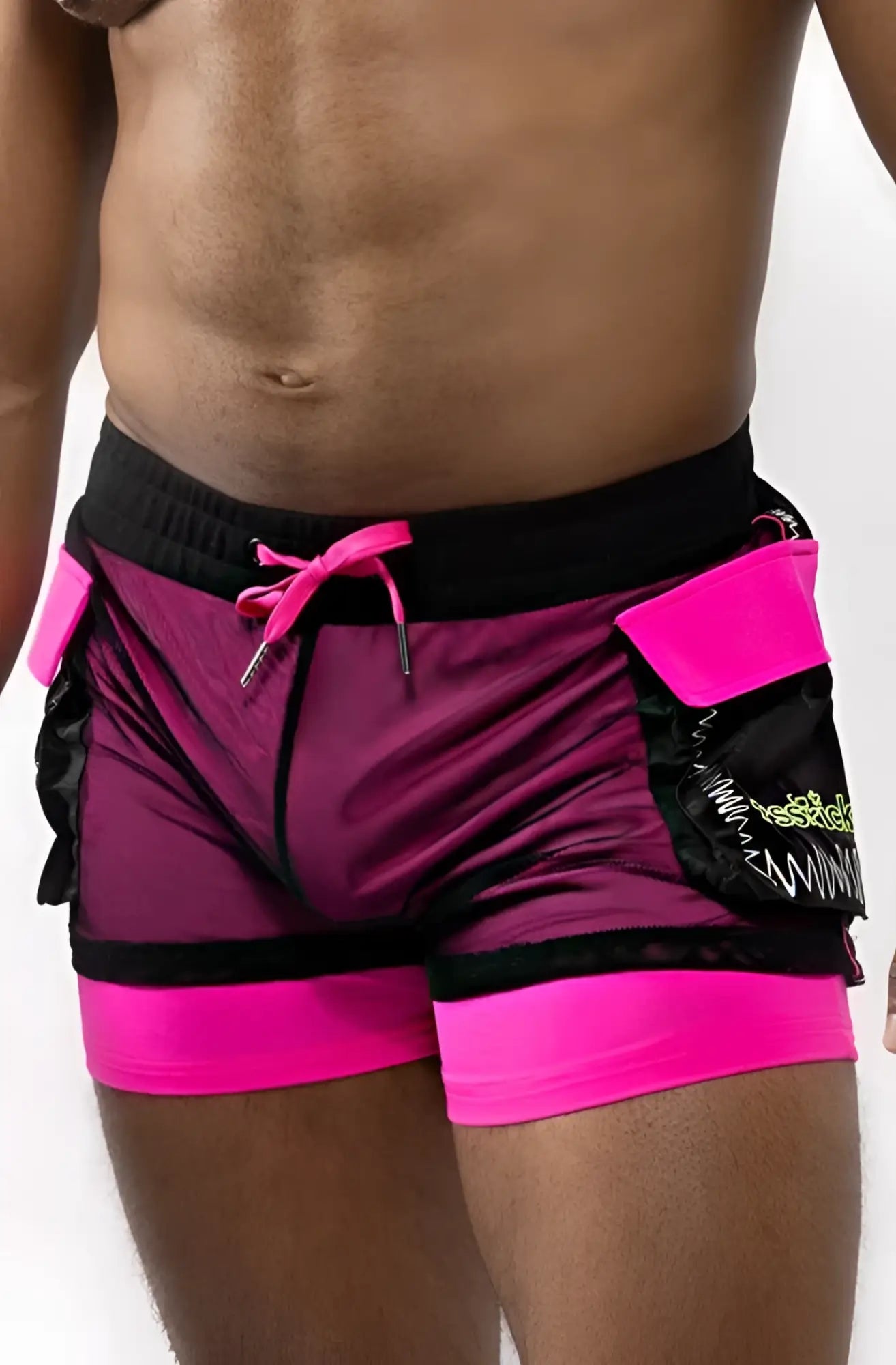 Electro cargo shorts in vibrant magenta and black mesh fabric with neon pink trim and bold pocket detailing