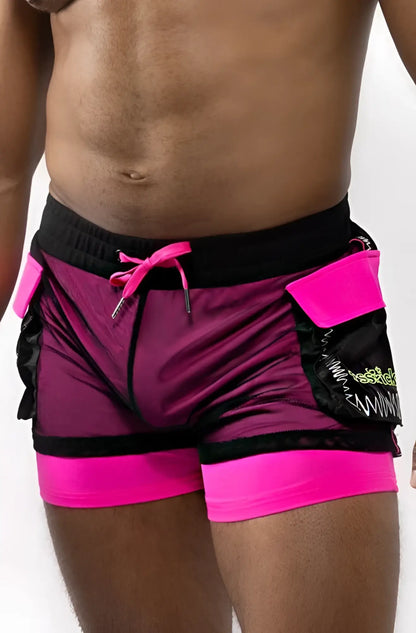 Electro cargo shorts in vibrant magenta and black mesh fabric with neon pink trim and bold pocket detailing