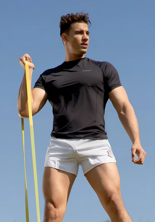 Black athletic t-shirt with short sleeves and subtle chest logo ideal for gym wear and active workouts