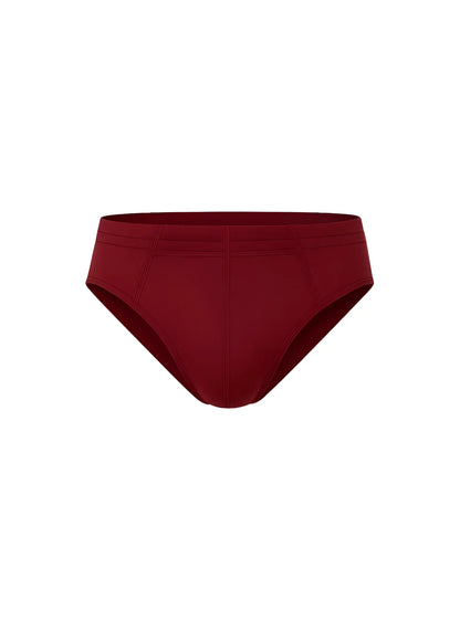A sleek solid burgundy essential cotton brief with smooth fabric finish and subtle seam detailing
