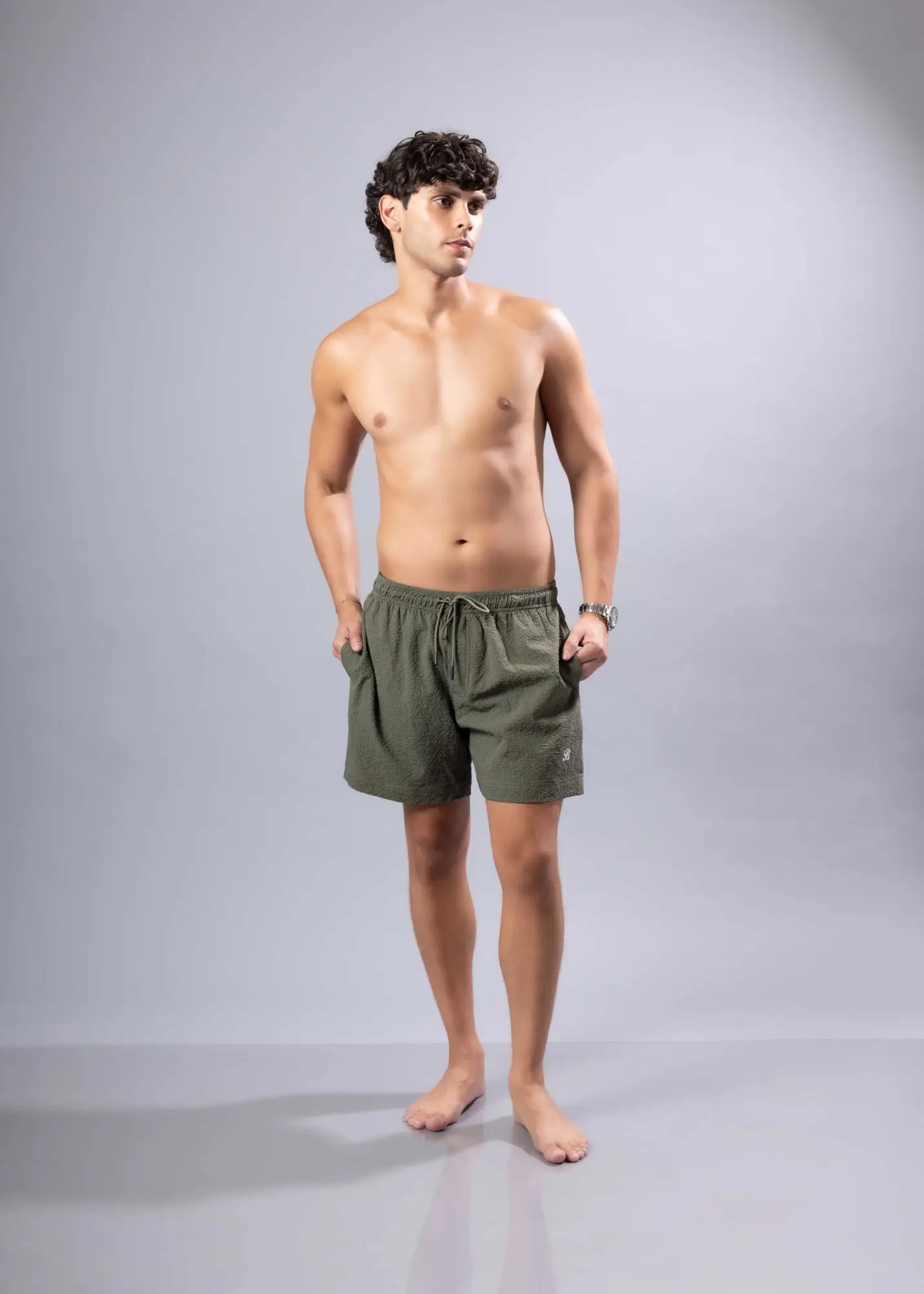 Olive green essential swim short with drawstring waist for comfortable and adjustable fit in swim trunks collection
