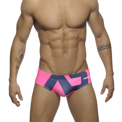 Extra-large logo brief bright pink and navy blue geometric swim trunks with addict branding for men