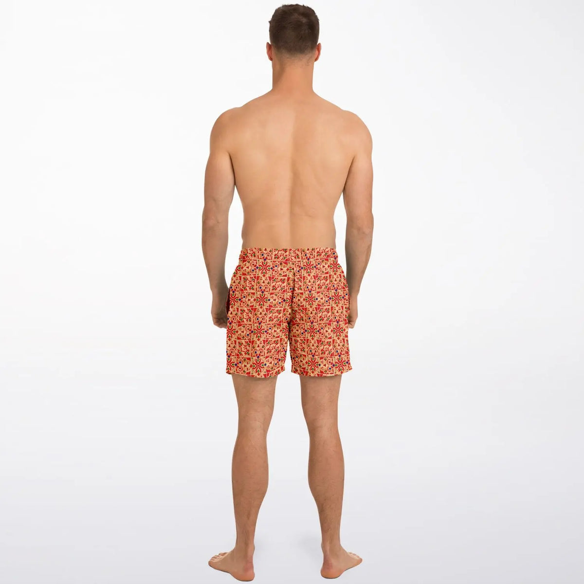 Men's swim shorts in vibrant red and yellow floral pattern made by Maris Equi shown on a model from the back.