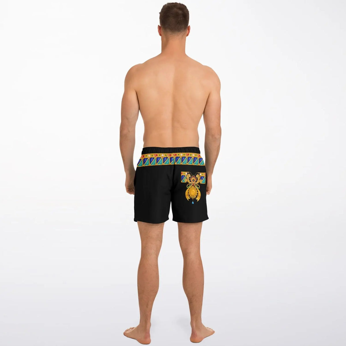Men's black swim shorts with colorful bejeweled waistband and decorative design shown on a model from the back by Maris Equi