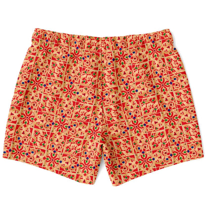 Men's swim shorts by Maris Equi in a vibrant red and yellow pattern featuring floral and geometric designs with an elastic waistband.