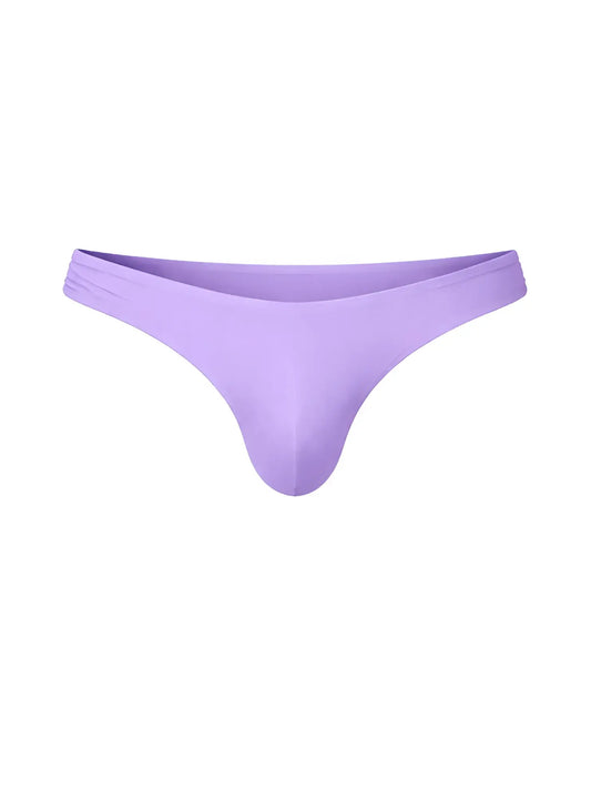 A sleek solid lavender fizx full coverage men’s bikini thong made of smooth stretchy fabric shown from the back