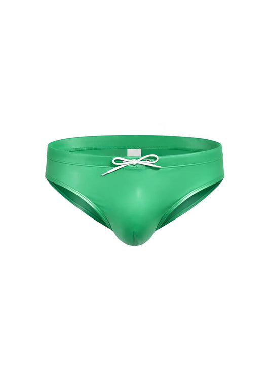 Vibrant green glossy faux leather swim trunks with white drawstring bow in fizx swim bikini with removable push pad