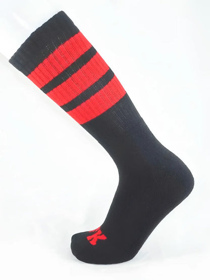 Fk sport black tube sock featuring bold red stripes and a small red logo on the toe for athletic use
