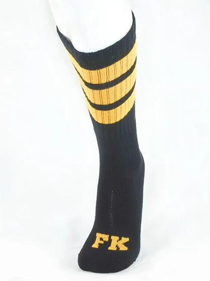 Fk sport black tube sock with three gold stripes and fk logo embroidered on the toe in gold thread