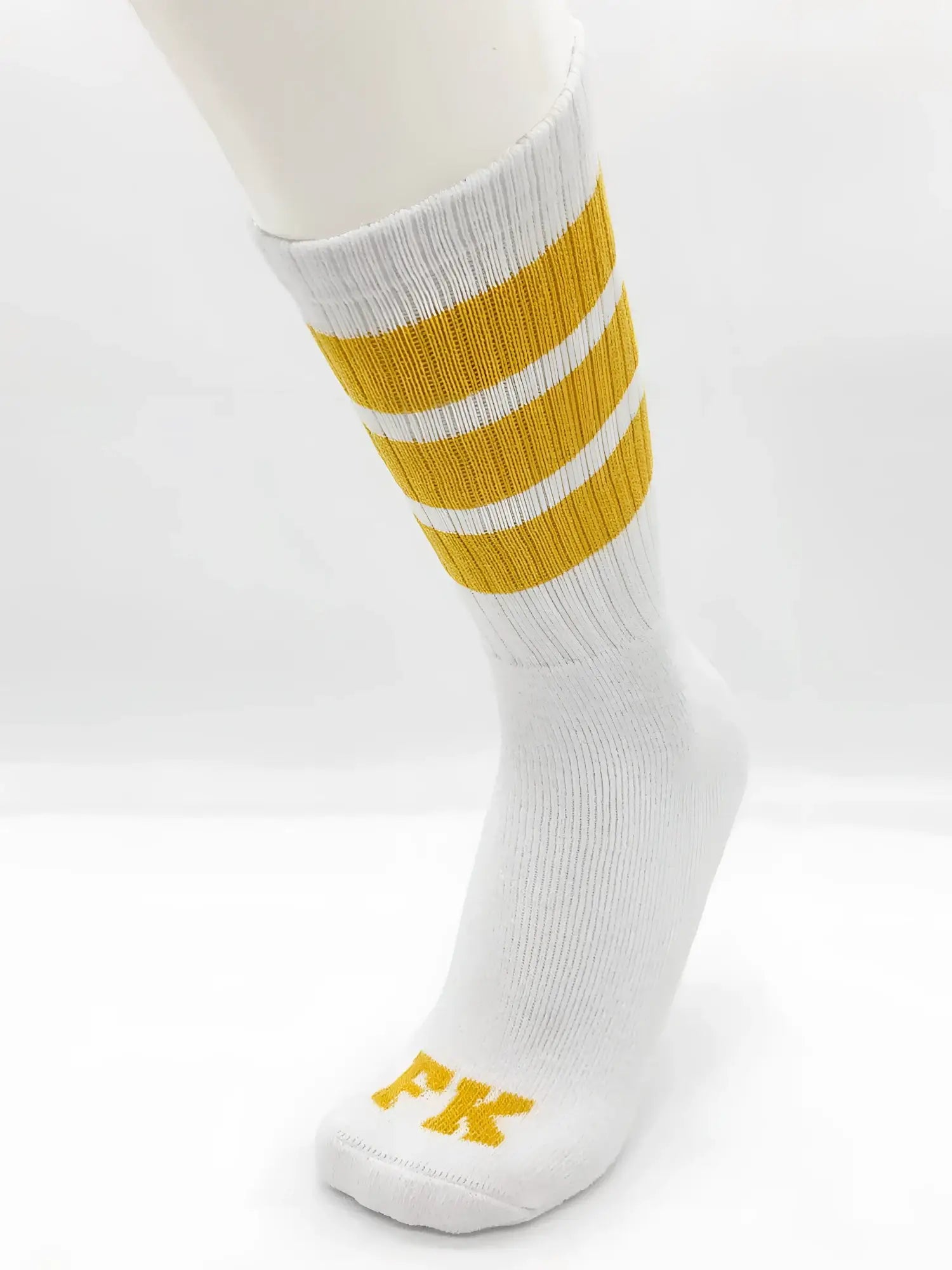 Fk sport white tube sock featuring white athletic fabric with three mustard-yellow stripes and fk logo on the toe