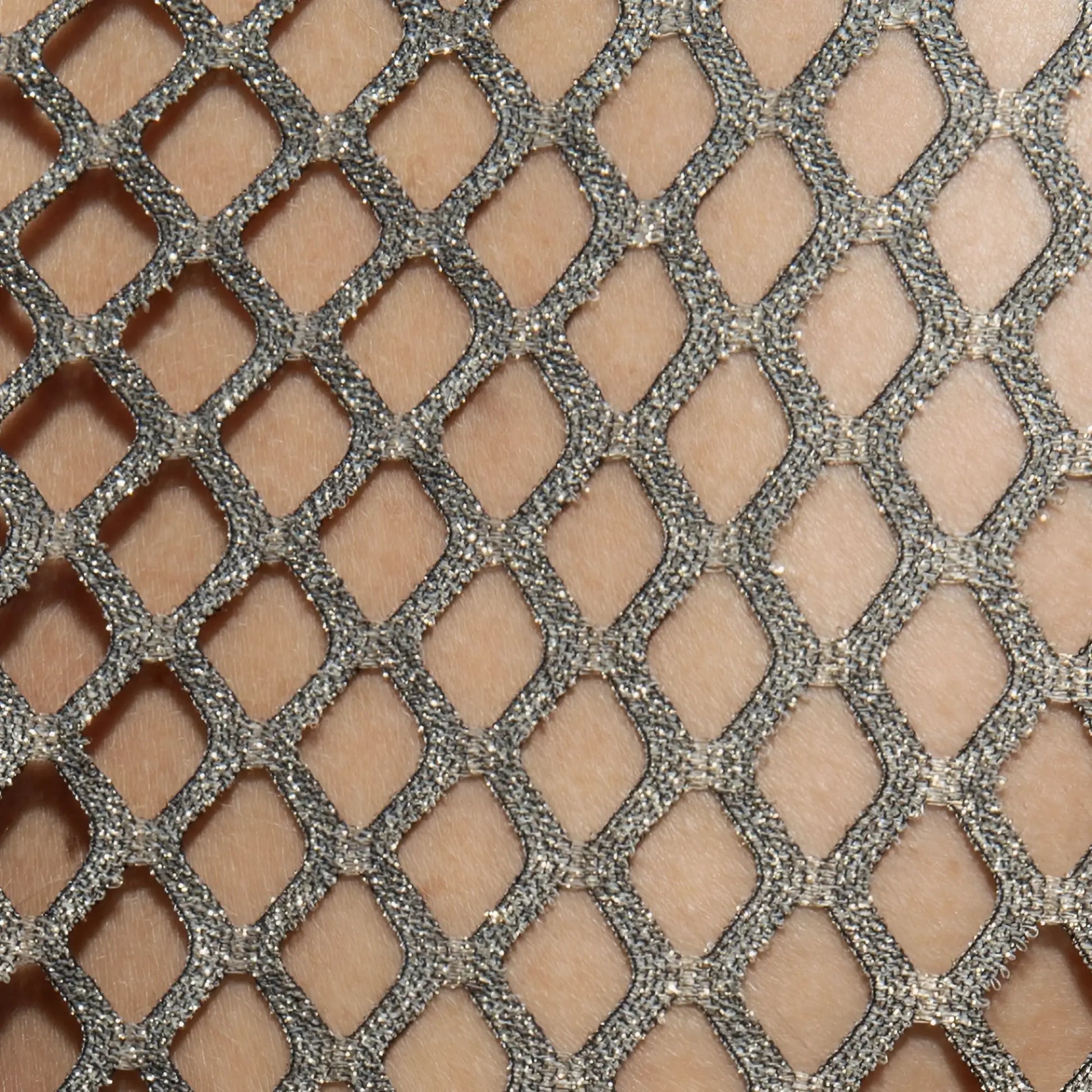 Silver glittery mesh fabric with diamond lattice pattern on flamboyant tank top front or back side