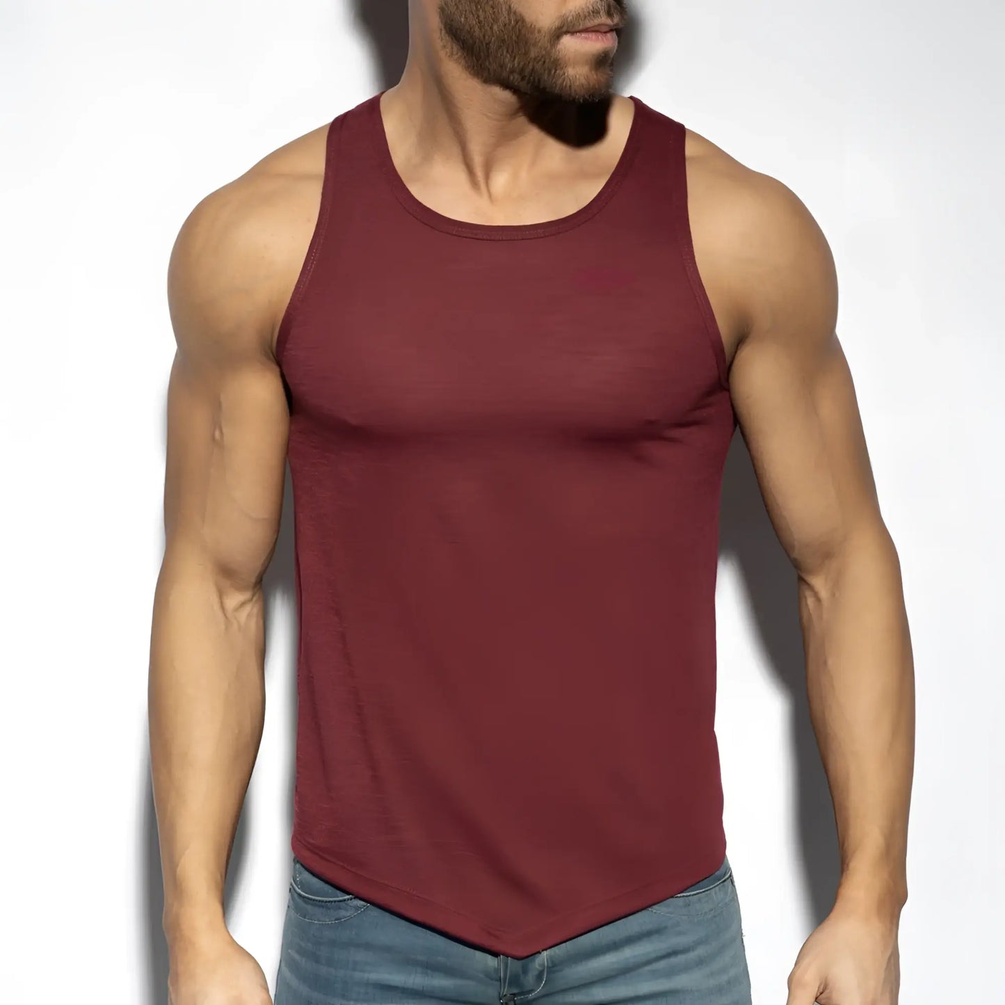 A maroon sleeveless flame tank top with rounded neckline and curved hemline for casual wear