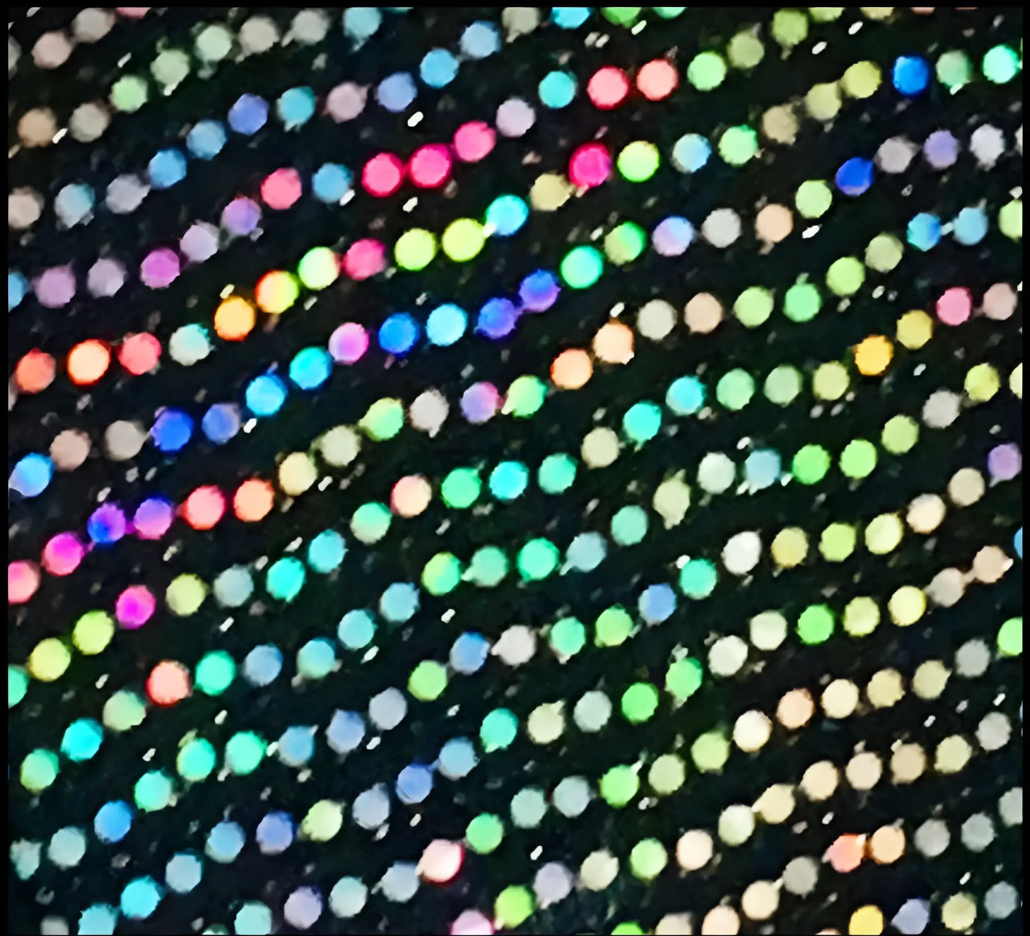 Black flat sequin hooded crop top with multicolored iridescent sequins on fabric for a sparkling look