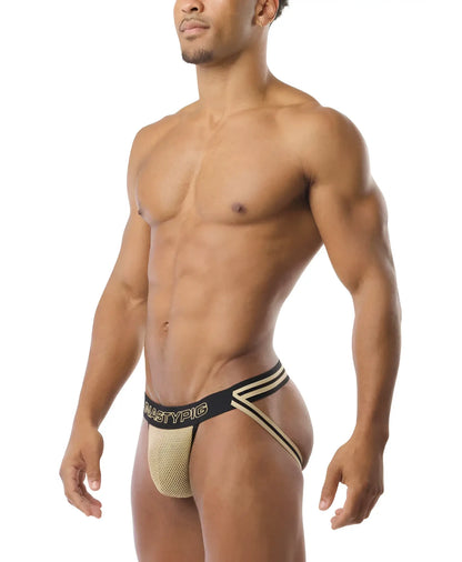 Beige mesh athletic briefs with black elastic waistband gold trim and mastypic branding in flip it jockstrap style
