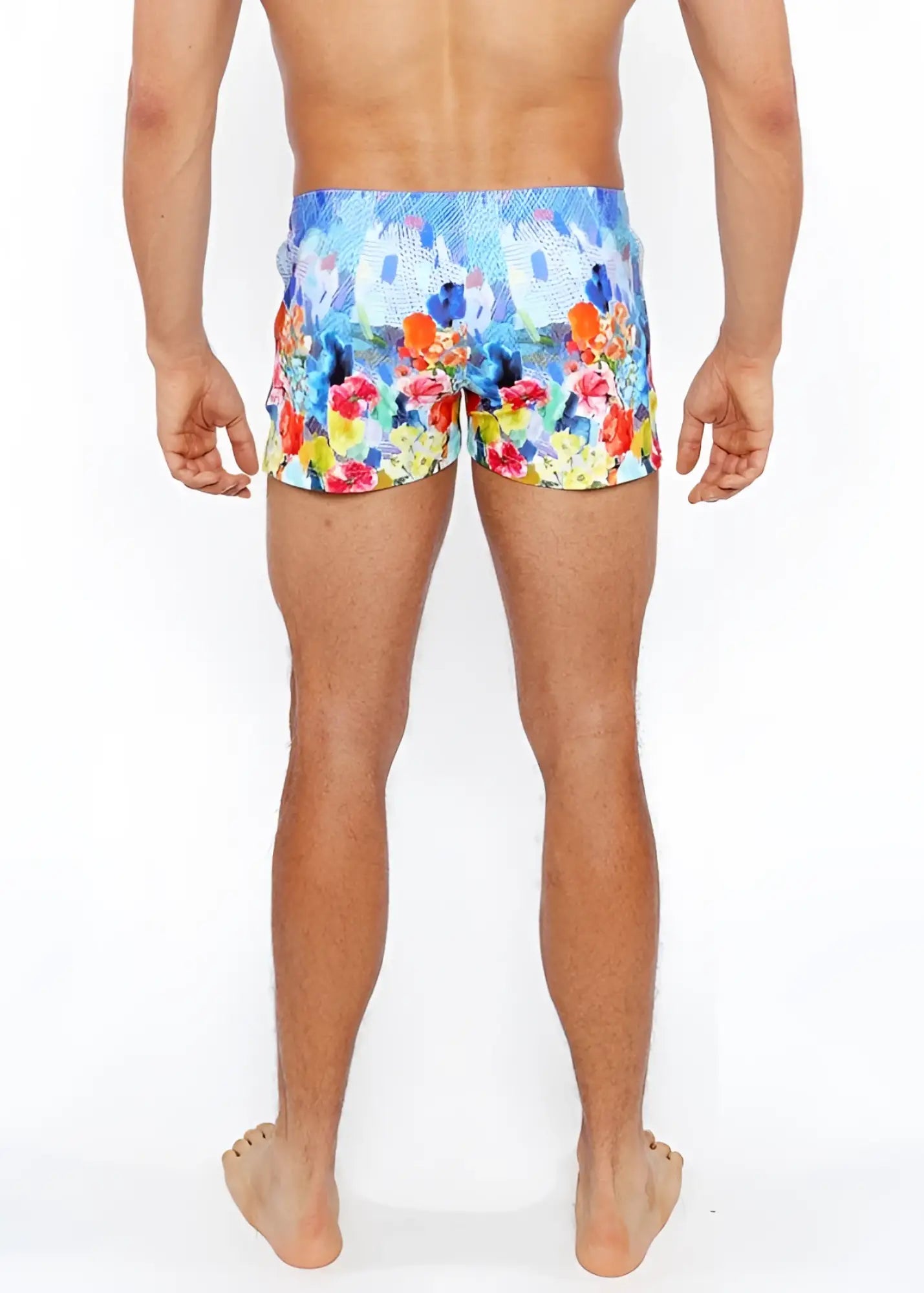 Floral abstract printed swim shorts with vibrant blue orange red and yellow floral pattern perfect for beachwear