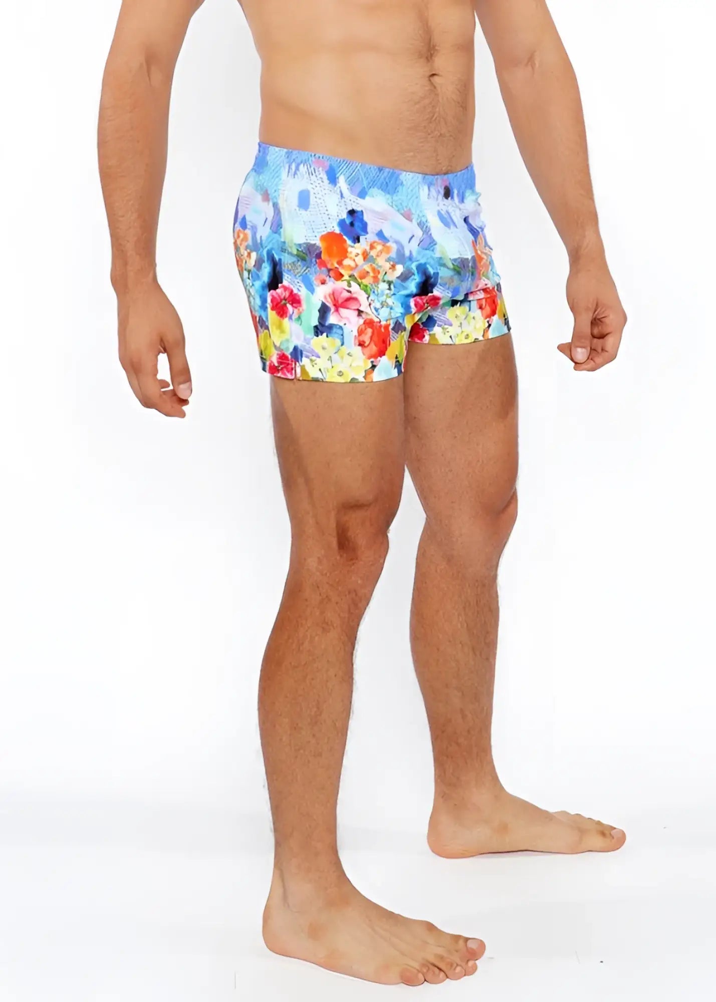 Floral abstract printed swim shorts with vibrant floral pattern in red orange yellow and blue perfect for beachwear