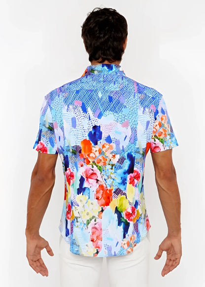 A vibrant short-sleeved woven modal button-up shirt with bold blue pink orange and yellow abstract floral pattern