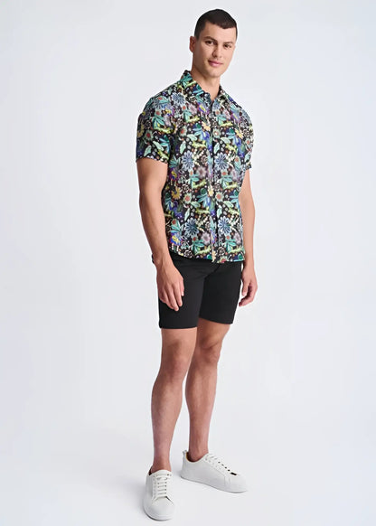 Men’s short-sleeved button-up shirt with vibrant multicolored floral pattern on dark lightweight linen tencel fabric