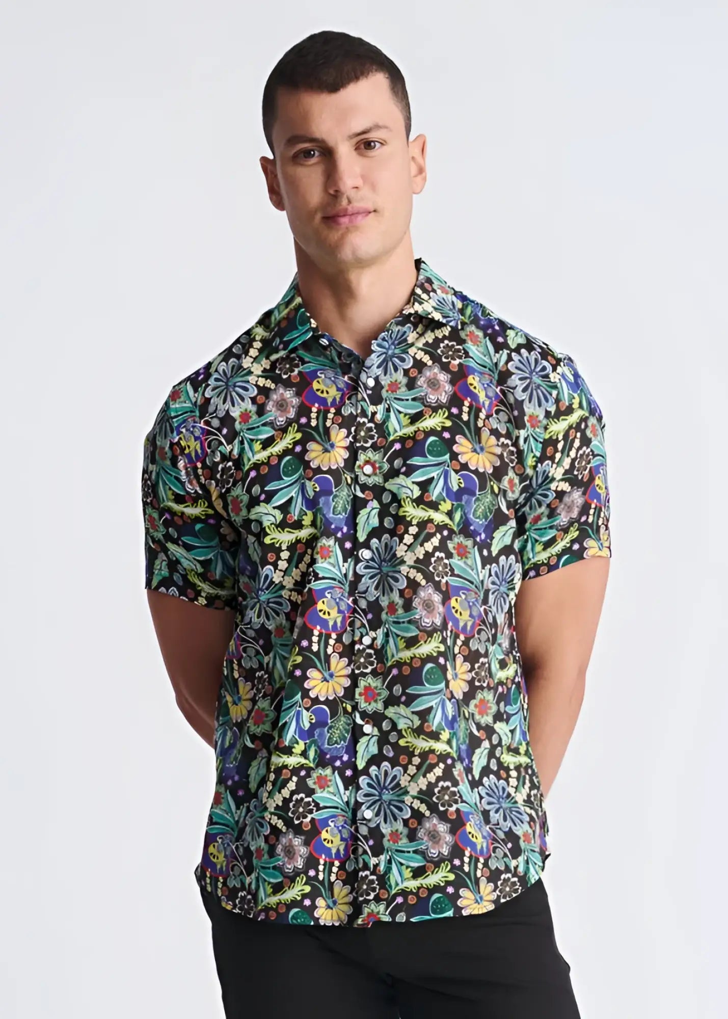 A vibrant floral lightweight linen tencel short-sleeved shirt with multicolored pattern on dark background