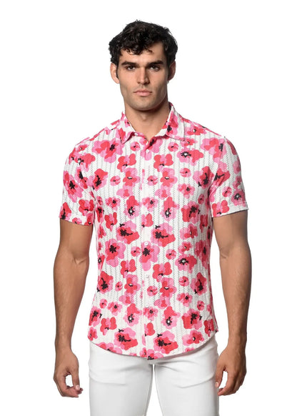 A man wearing a short-sleeved floral print open knit shirt with vibrant pink flowers on a white background