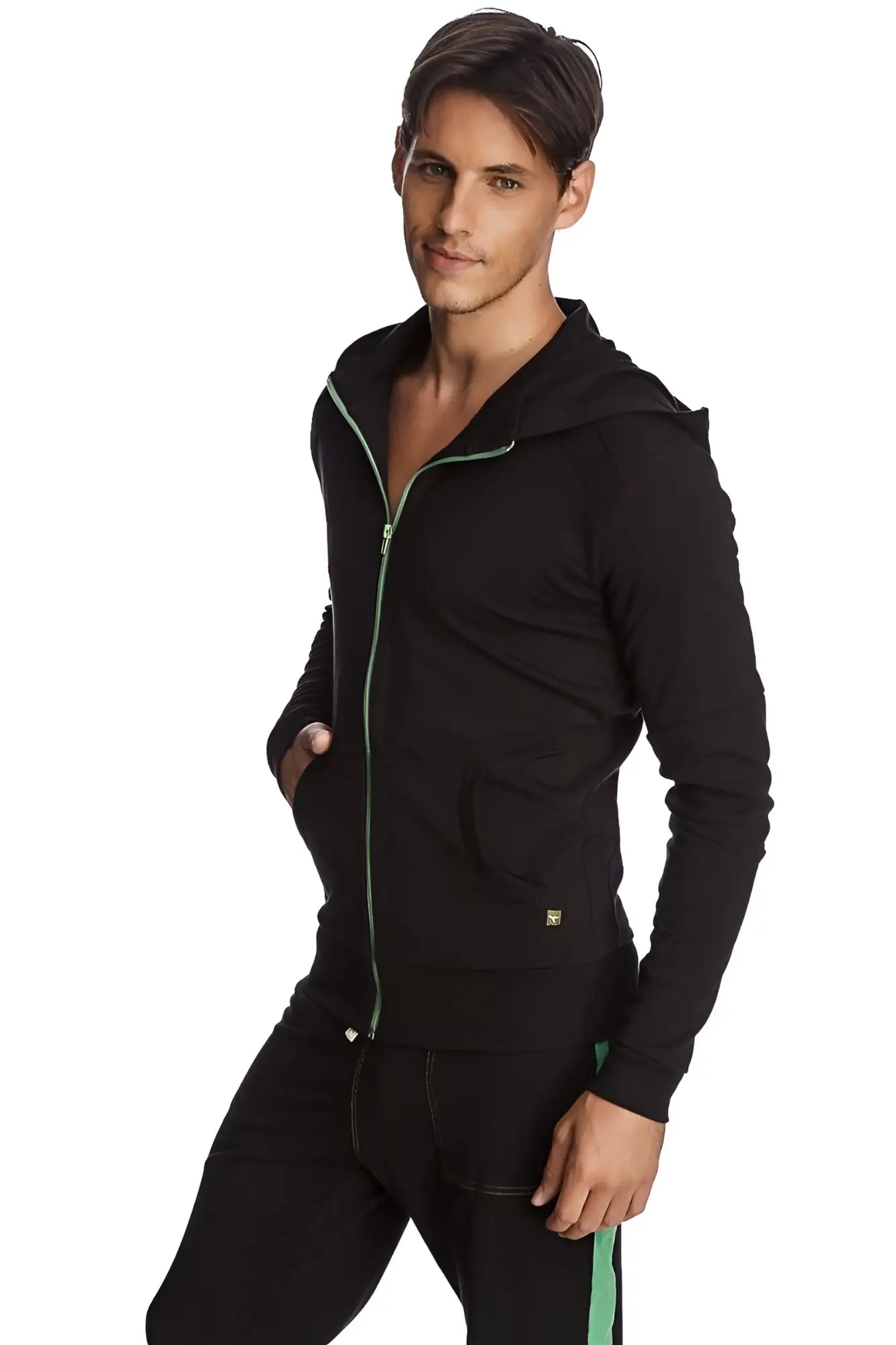 Black form-fit crossover yoga track hoodie with green zipper trim and matching side stripe on pants for performance use