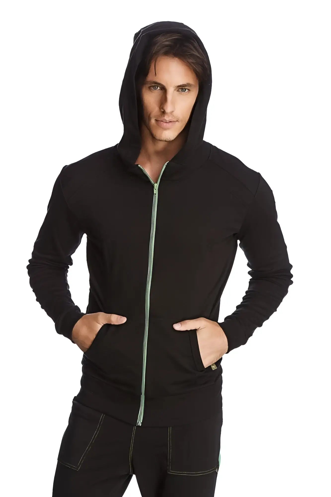 Black form-fit crossover yoga track performance hoodie with subtle green zipper pull and matching seam stitching