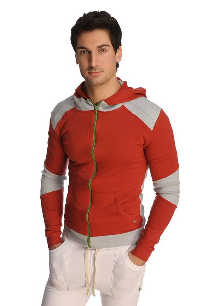 Form-fit crossover yoga track performance hoodie in cinnabar grey with red and gray panels, green zipper pull, and front pockets