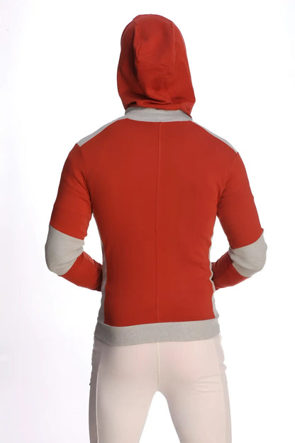 Form-fit crossover yoga track performance hoodie in cinnabar red with grey accents on shoulders sleeves and waistband