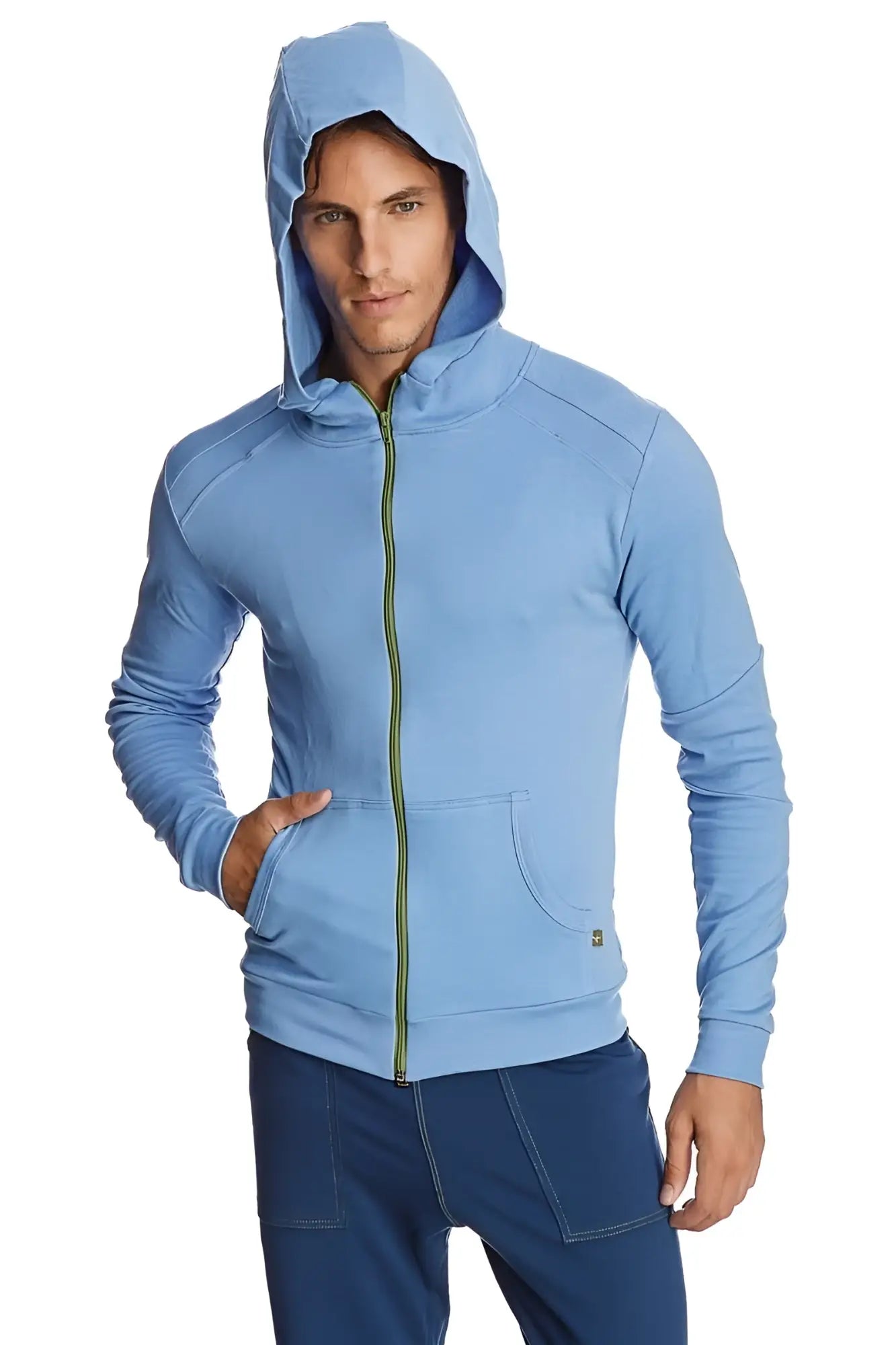 Form-fit crossover yoga track performance hoodie in light blue with green zipper and subtle seam detailing