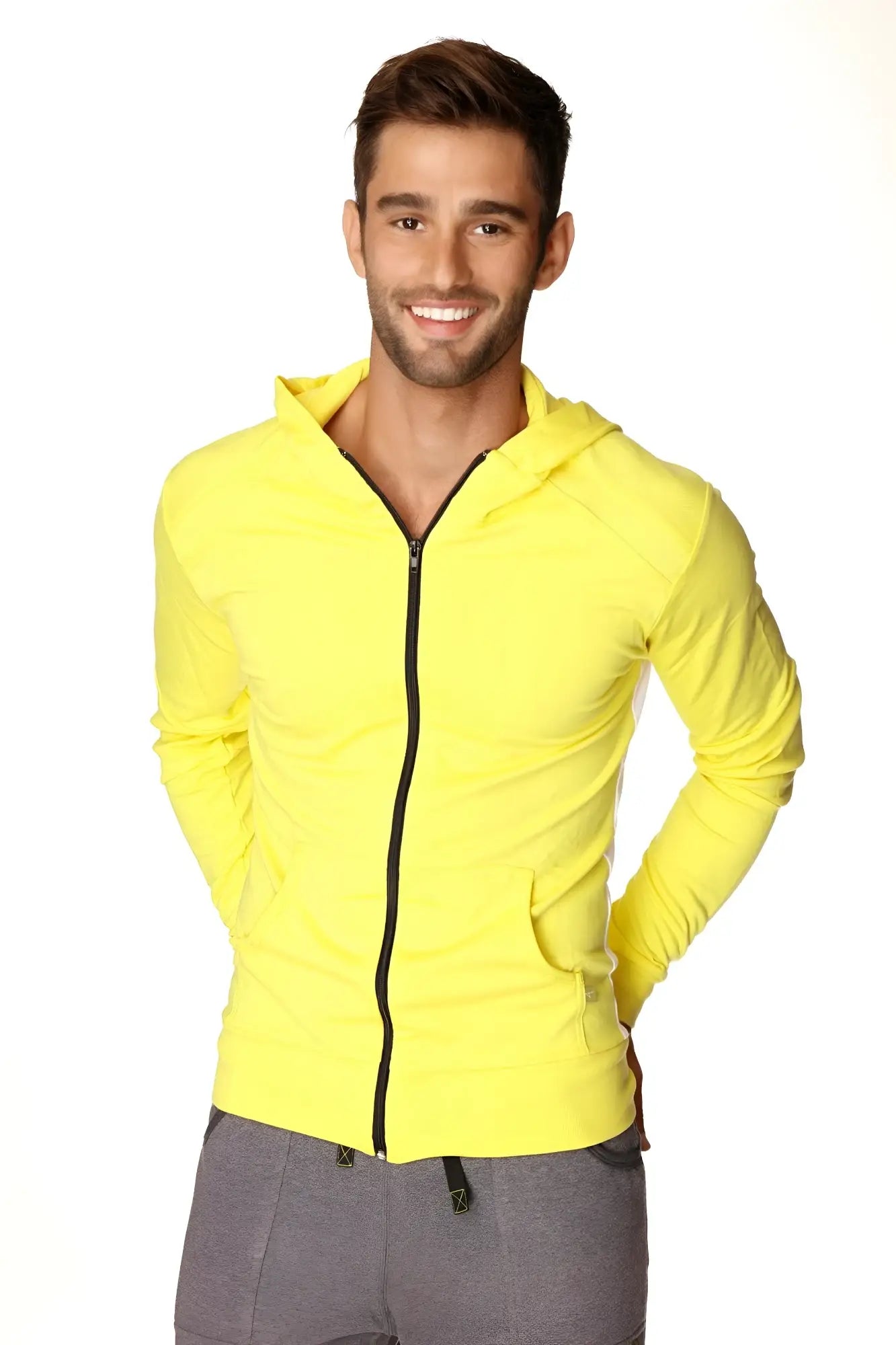 Form-fit crossover yoga track performance hoodie in tropic yellow with black zipper and front pockets for active wear
