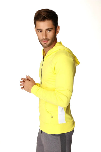 Bright yellow form-fit crossover yoga track hoodie with white side panels and matching hood for performance wear
