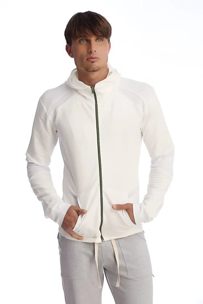 Form-fit crossover yoga track performance hoodie in white with a subtle green zipper and ribbed cuffs