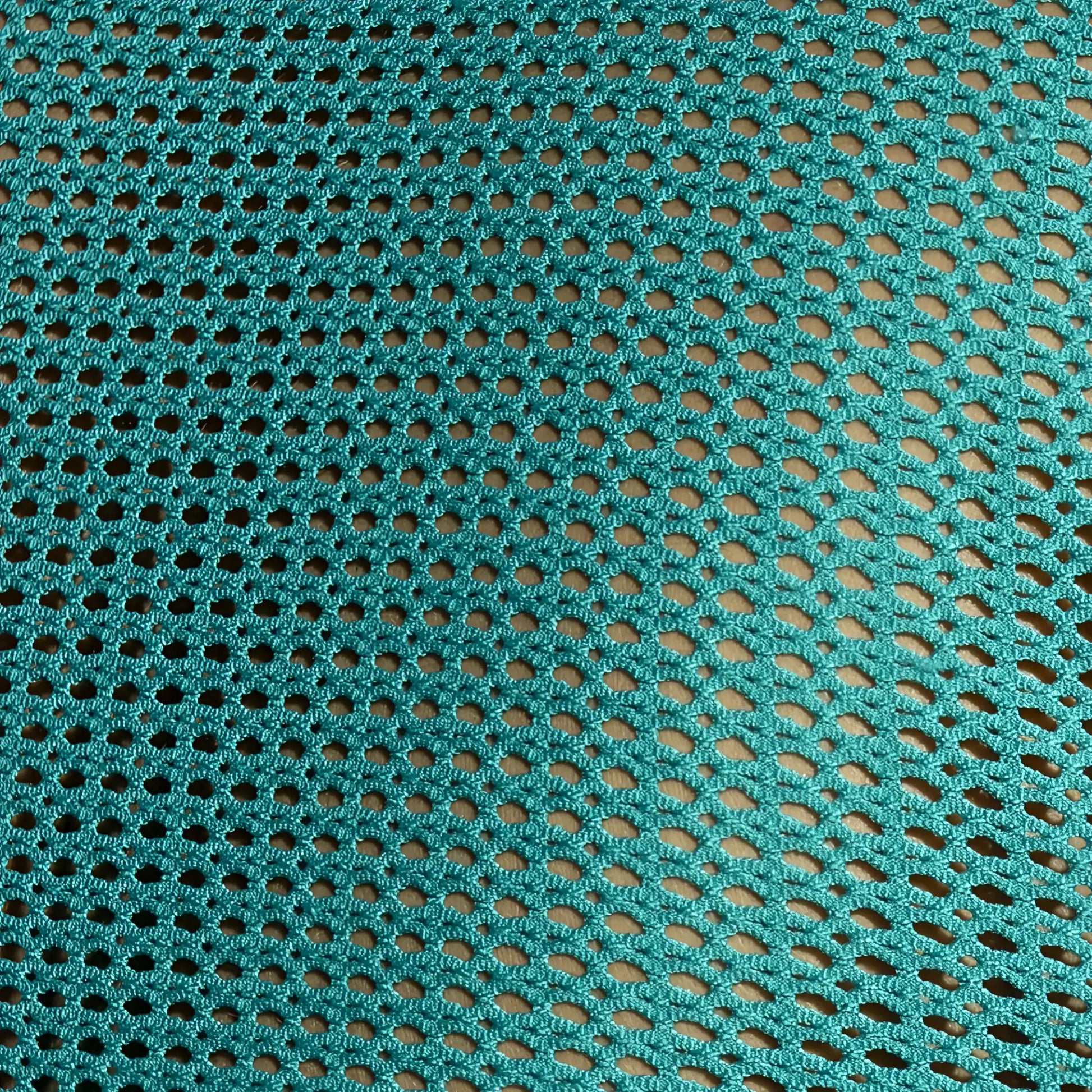 Teal crocheted mesh fabric with oval holes on formentera retro tank top showing breathable lightweight design